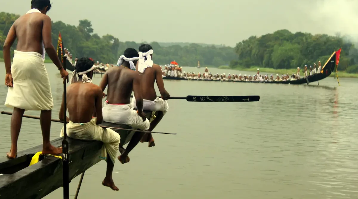 Kerala Cultural and Heritage Tour Packages featuring traditional snake boat festival on Kerala backwaters