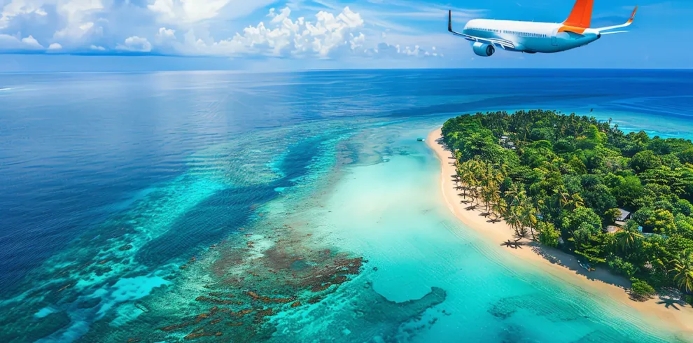 Classic Kerala Tour Package featuring a tropical island beach, turquoise waters, lush greenery, and a scenic flight over the Arabian Sea