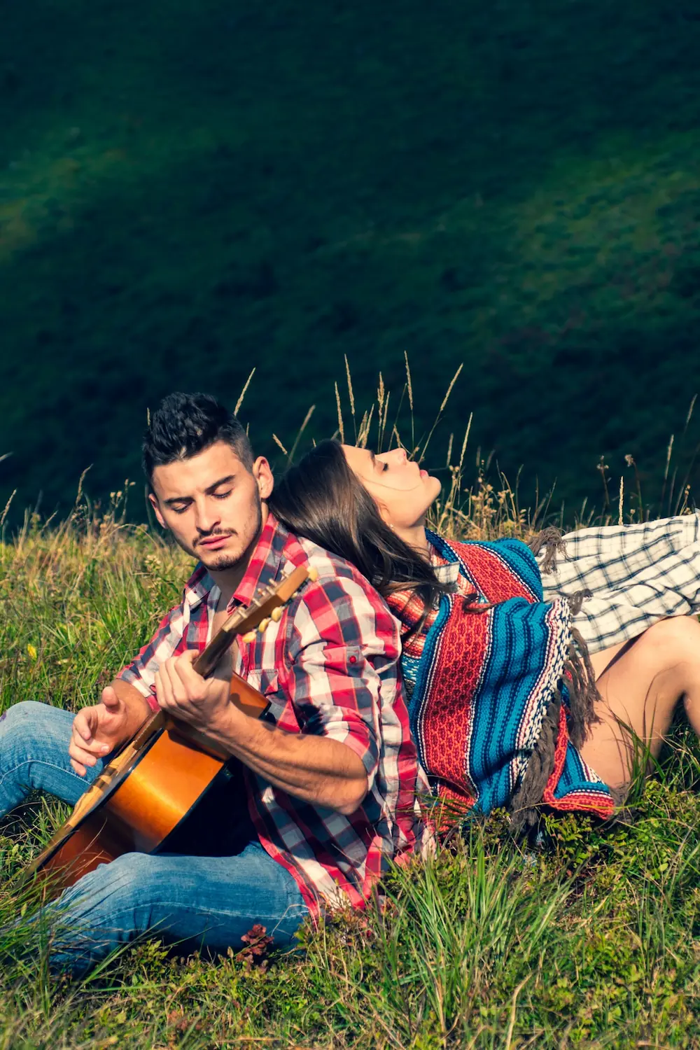 Kerala Couples Luxury Trip capturing a romantic couple relaxing in scenic nature during their private Kerala holiday experience.