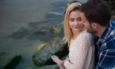 Kerala deluxe honeymoon tour featuring a couple enjoying a peaceful lakeside sunset moment during a romantic Kerala escape