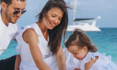 Premium Kerala holiday package featuring a happy family relaxing on a scenic Kerala beach during a luxury coastal vacation