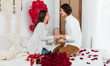 Romantic Kerala Couple Tour image showing a honeymoon couple enjoying a private indoor romantic setup with rose pet décor in Kerala.