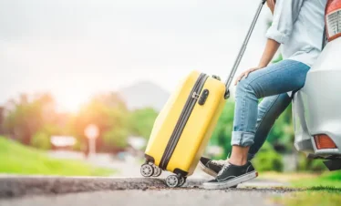 Kerala tour from Kochi showing a traveller arriving with luggage